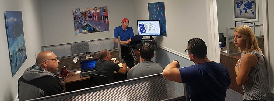 The CarChat24 team enjoys training in its new Tampa Bay area office.